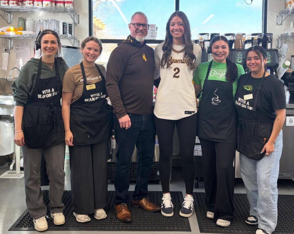 The Human Bean of Laramie owner Matt Lockhart with his team and UW Women's BBall's Jane Rumpf, guest barista in March 2026! image courtesy Human Bean of Laramie